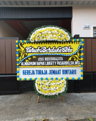 Papan Bunga Duka di Kakaskasen Satu